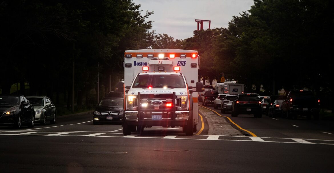 white and red car on road during night time
