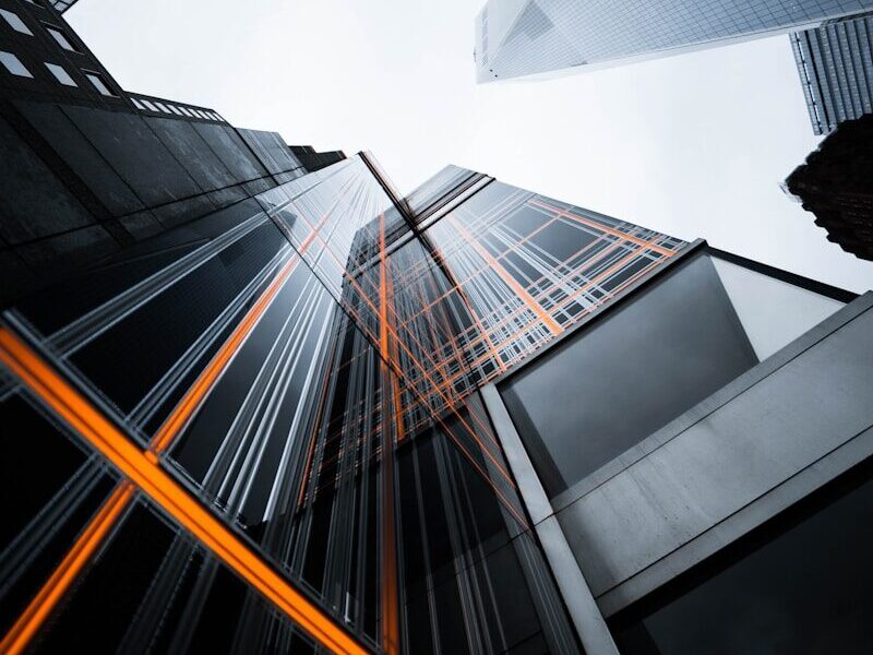 low-angle photo of high-rise buildings under white sky